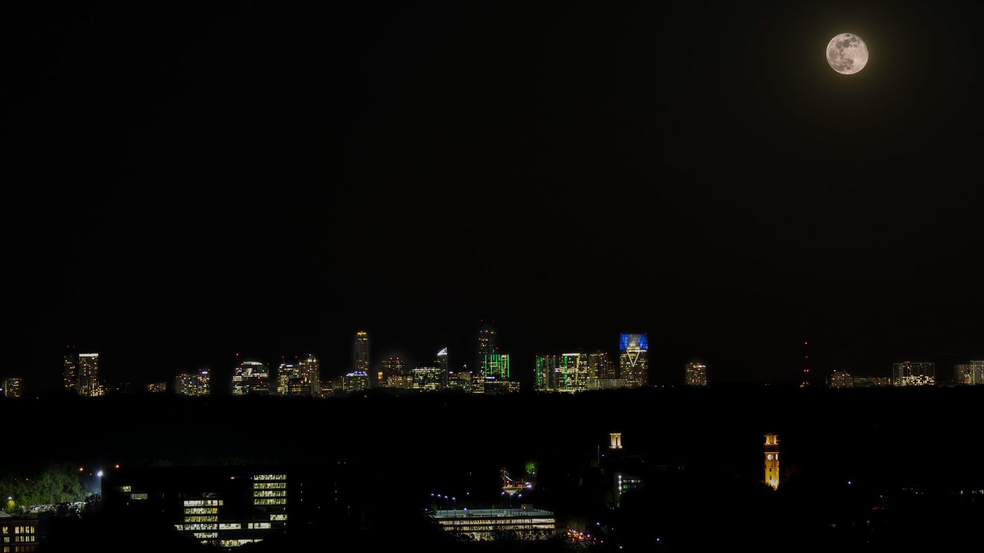Full moon rising over Atlanta skyline